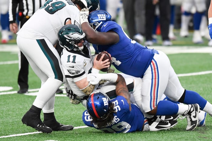 New York Giants defensive end Leonard Williams (99) and lineman Dalvin Tomlinson (94) sack Philadelphia Eagles quarterback Carson Wentz (11) in the second half. The Giants defeat the Eagles, 27-17, at MetLife Stadium on Sunday, Nov. 15, 2020.